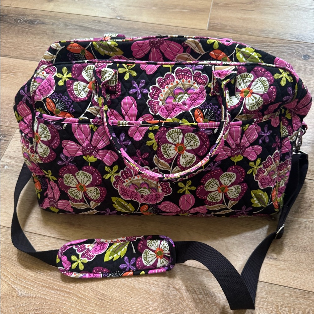 Vera Bradley weekender bag with luggage pocket to attach to suitcase.